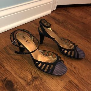 A pair of black open toed heels